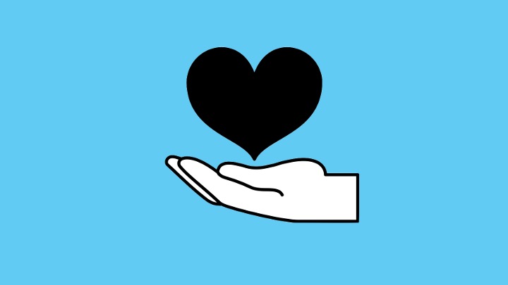 hand holding heart tile